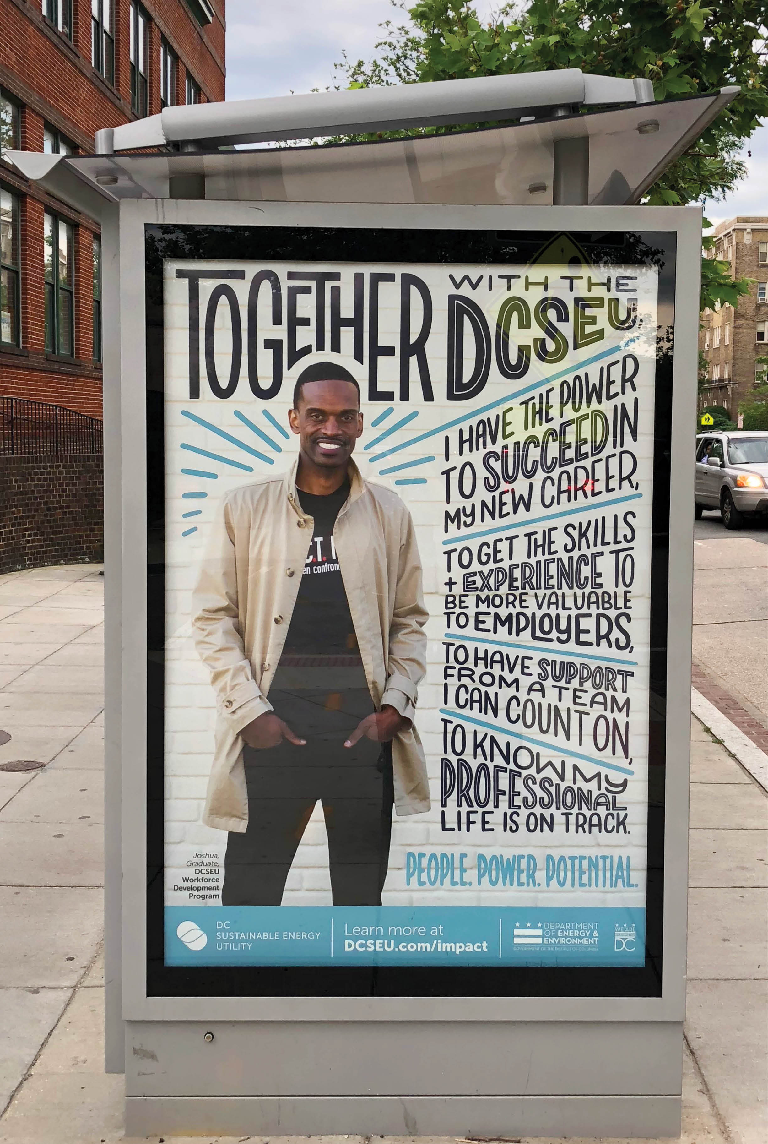 Image of bus shelter poster, featuring a man smiling with his hands in his pockets. He stands against a while wall and is surrounded by blue hand lettering featuring his testimonial about using the DCSEU workforce development programs.