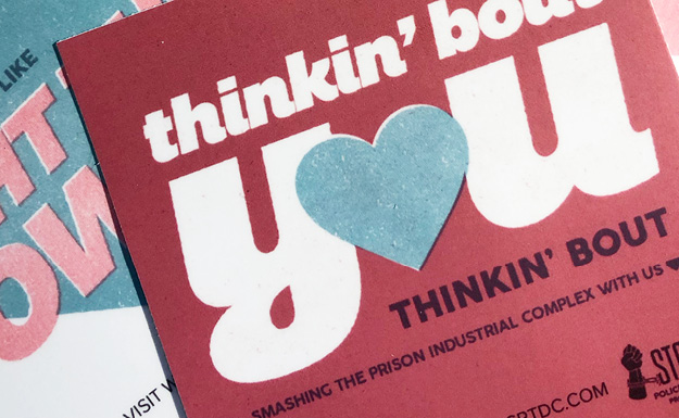 Design Choice are marketing design specialists: Close up of a valentine reading Thinking 'bout you thinking 'bout smashing the prison industrial complex with us